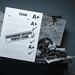 - VeyrZest.com Messy workshop desk with tangled wires and gears, overlaid by an exam sheet showing A+ scores and a 'Benchmark Success: Perfect Score' stamp.
