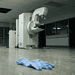 - VeyrZest.com MRI scanner in a quiet hospital hallway, with blue scrubs lying on the floor in the foreground.